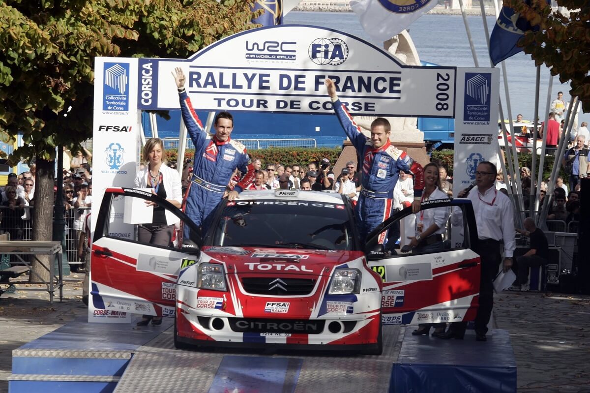 Sébastien Ogier on the podium at the 2008 Tour de Corse with the Citroën C2 Super 1600